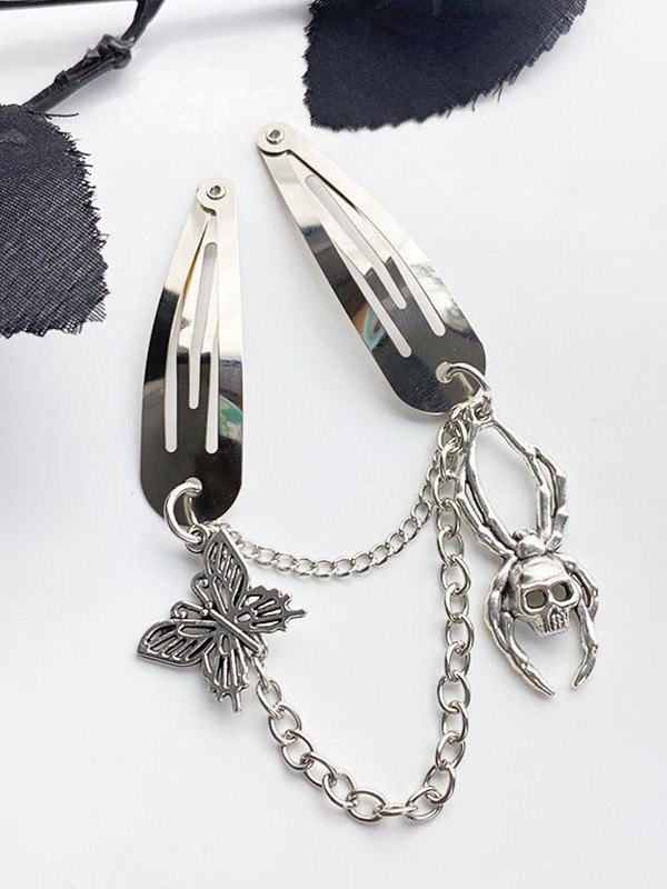 Broche para el cabello con dije de mariposa y calavera-1
